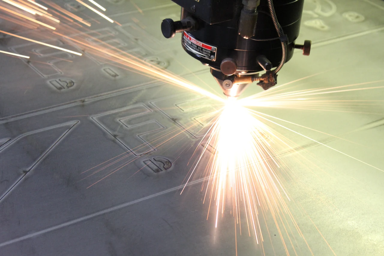 Sparks from precision laser cutting in FELBRO's manufacturing archive