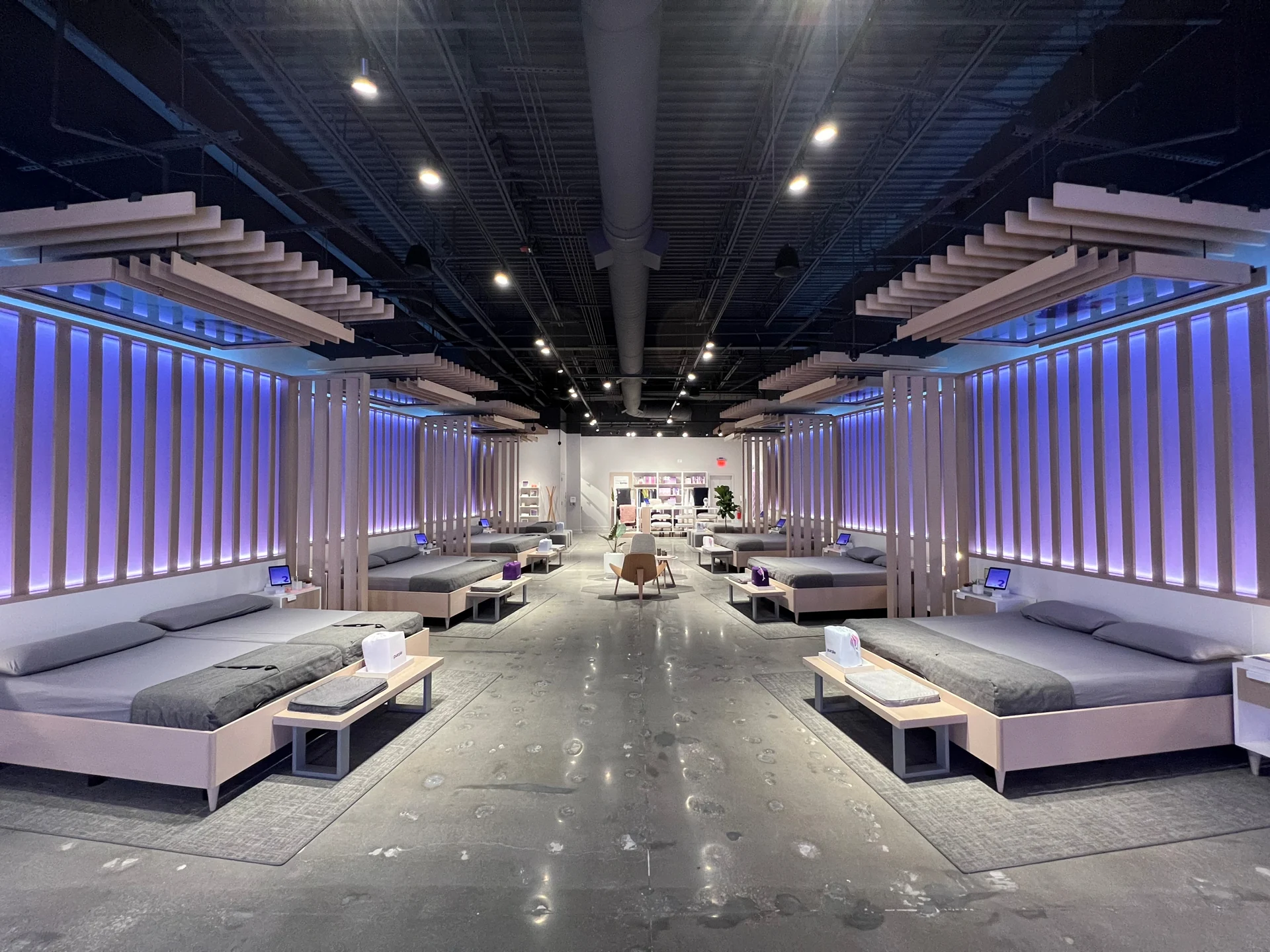 Purple showroom in Leawood, with lavender slatted walls framing a long, welcoming retail space